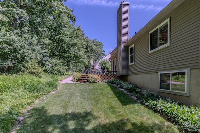 3105 Earlmoore Ln, Ann Arbor, MI 48105 - view of grassy yard featuring a wooden deck and stairs