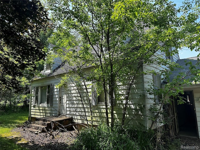 12910 Wilbur Rd, Clinton, MI 49236 - view of home's exterior featuring a shingled roof