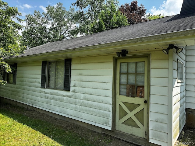 12910 Wilbur Rd, Clinton, MI 49236 - view of side of property featuring a shingled roof