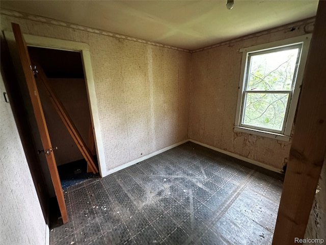 12910 Wilbur Rd, Clinton, MI 49236 - spare room with dark flooring and baseboards