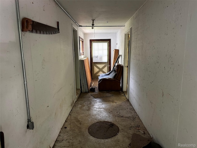 12910 Wilbur Rd, Clinton, MI 49236 - corridor featuring unfinished concrete flooring