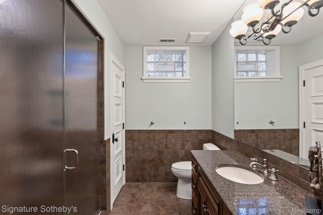 597 Yarboro Dr, Bloomfield Hills, MI 48304 - bathroom featuring tile walls, vanity, a stall shower, wainscoting, and tile patterned floors