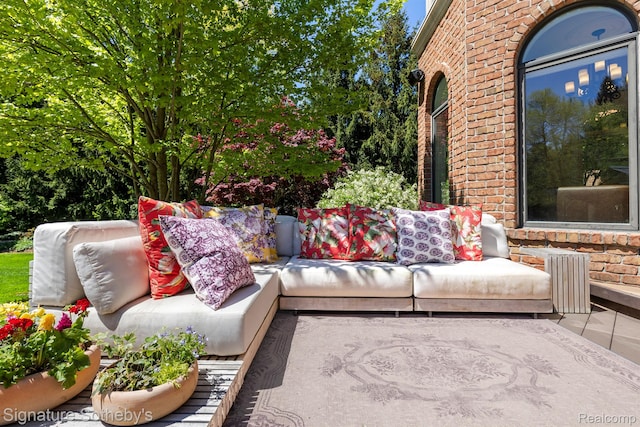 597 Yarboro Dr, Bloomfield Hills, MI 48304 - view of patio with outdoor lounge area and radiator