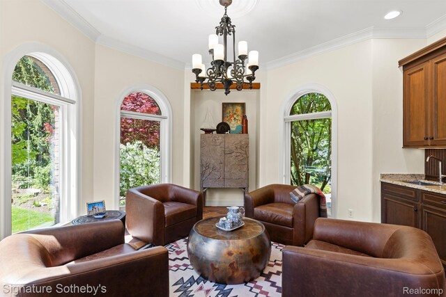 597 Yarboro Dr, Bloomfield Hills, MI 48304 - living room featuring a chandelier, healthy amount of natural light, and ornamental molding