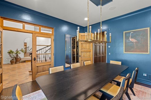597 Yarboro Dr, Bloomfield Hills, MI 48304 - dining space with stairway, crown molding, and wood finished floors