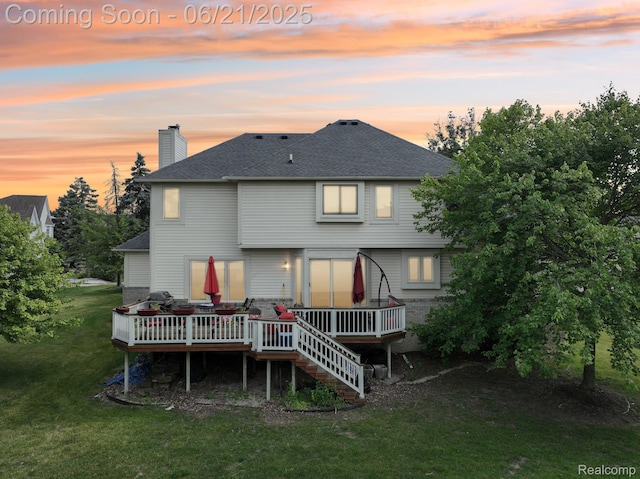 21898 Aspen Ct, Farmington Hills, MI 48335 - back of property at dusk featuring a deck, a lawn, a chimney, and roof with shingles
