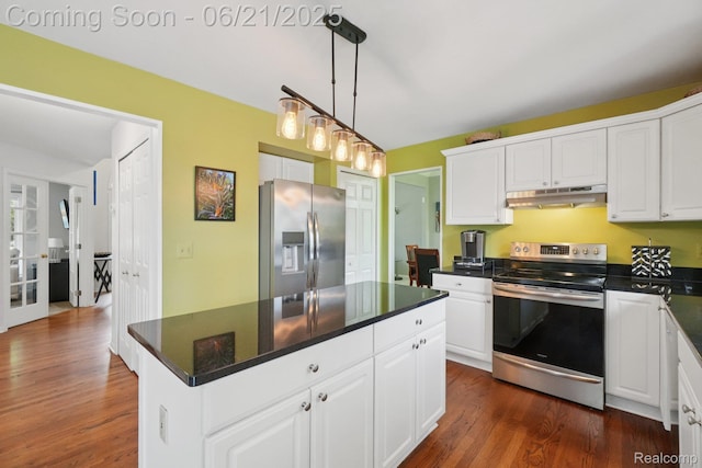 21898 Aspen Ct, Farmington Hills, MI 48335 - kitchen featuring appliances with stainless steel finishes, under cabinet range hood, dark countertops, white cabinets, and dark wood finished floors