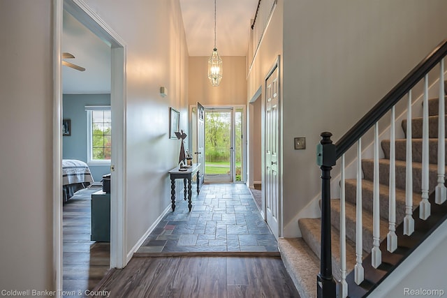 1355 Maxfield Rd, Brighton, MI 48114 - foyer featuring stairs, stone tile flooring, and a high ceiling