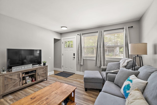 645 Amity Ave, Muskegon, MI 49442 - living area with baseboards and light wood-style floors