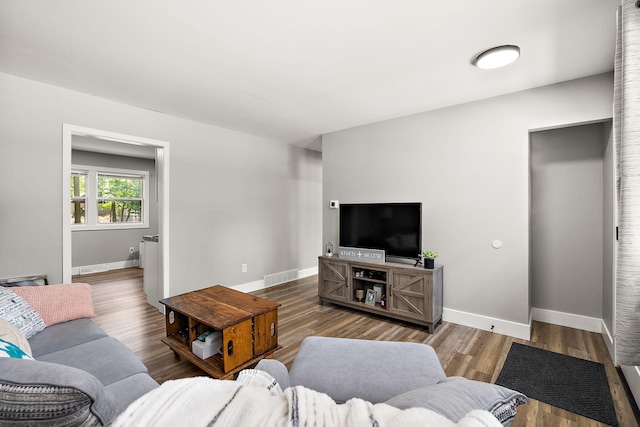 645 Amity Ave, Muskegon, MI 49442 - living room with baseboards and wood finished floors
