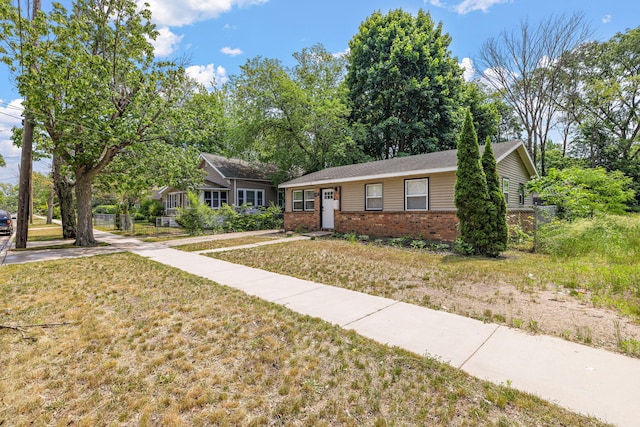 645 Amity Ave, Muskegon, MI 49442 - single story home featuring brick siding and a front yard