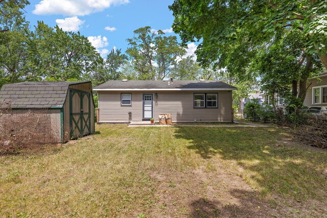 645 Amity Ave, Muskegon, MI 49442 - back of house with a shed