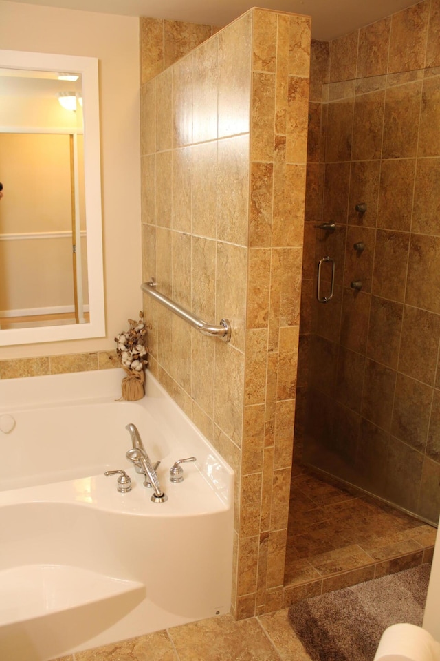 7680 S Warner Ave, Fremont, MI 49412 - full bath featuring a stall shower and a bath