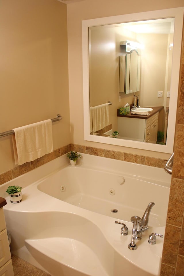 7680 S Warner Ave, Fremont, MI 49412 - bathroom featuring vanity and a tub with jets