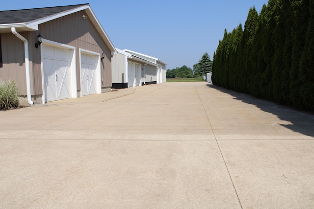 7680 S Warner Ave, Fremont, MI 49412 - view of property exterior featuring a garage