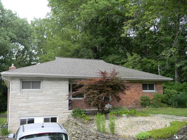 6864 Hazeldell Dr, Temperance, MI 48182 - view of front of house with roof with shingles and stone siding