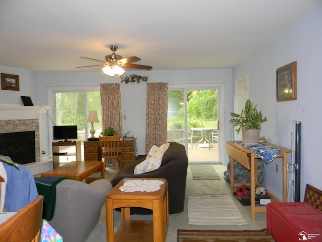 6864 Hazeldell Dr, Temperance, MI 48182 - living area featuring a ceiling fan and a fireplace