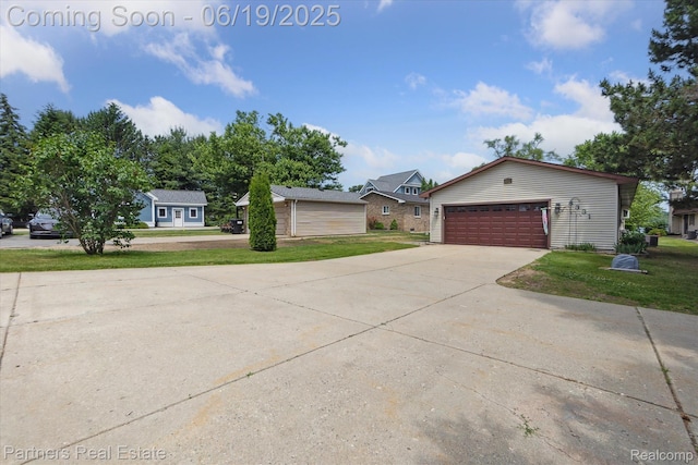 8331 Hilton Rd, Brighton, MI 48114 - view of front of property featuring a garage, a front lawn, and concrete driveway