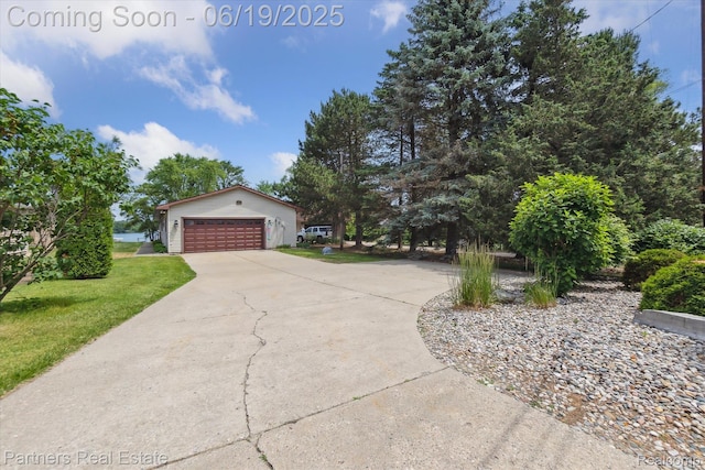 8331 Hilton Rd, Brighton, MI 48114 - view of side of property with a garage and a yard