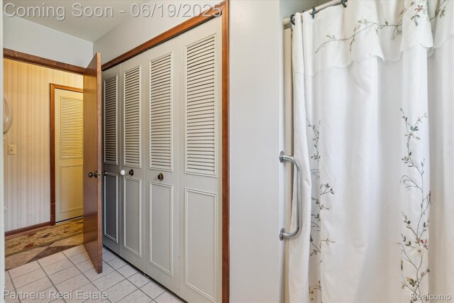 8331 Hilton Rd, Brighton, MI 48114 - bathroom with a closet, tile patterned flooring, and curtained shower