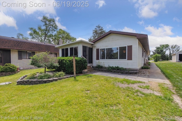 8331 Hilton Rd, Brighton, MI 48114 - view of front of house featuring entry steps and a front lawn
