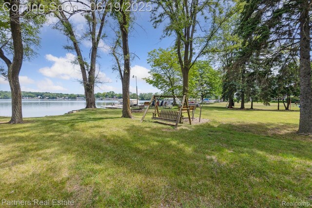 8331 Hilton Rd, Brighton, MI 48114 - view of grassy yard featuring a water view