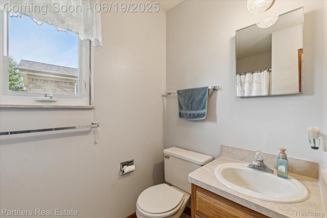 8331 Hilton Rd, Brighton, MI 48114 - bathroom with vanity and toilet