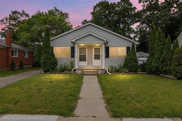 1545 W 9 Mile Rd, Ferndale, MI 48220 - bungalow-style house with a front lawn
