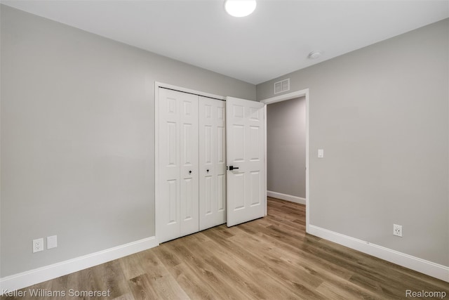 1545 W 9 Mile Rd, Ferndale, MI 48220 - unfurnished bedroom with light wood-style floors and a closet
