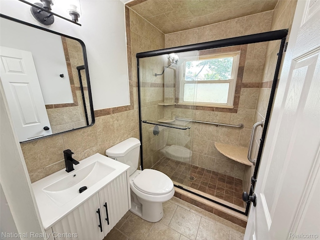 23074 Bolam Ave, Warren, MI 48089 - bathroom featuring vanity, a stall shower, tile walls, and wainscoting