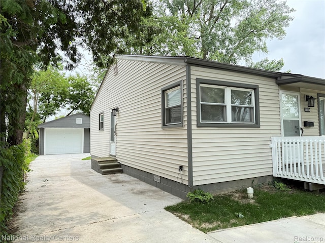 23074 Bolam Ave, Warren, MI 48089 - view of home's exterior with an outdoor structure and a garage