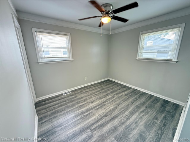 23074 Bolam Ave, Warren, MI 48089 - unfurnished room with dark wood-style flooring, a ceiling fan, and crown molding