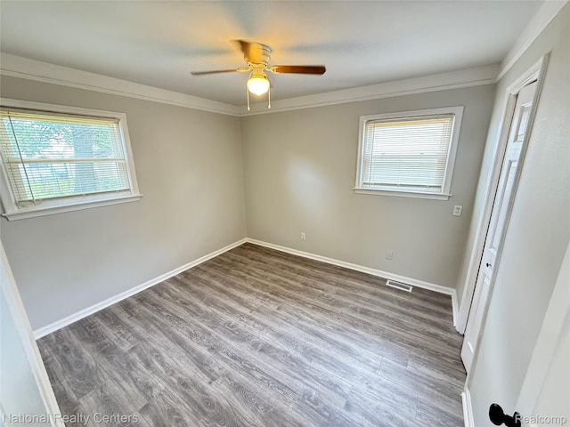 23074 Bolam Ave, Warren, MI 48089 - spare room featuring wood finished floors, a ceiling fan, and ornamental molding