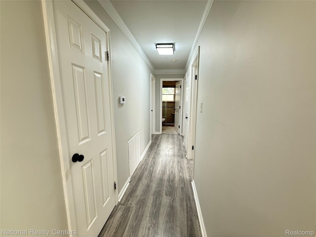 23074 Bolam Ave, Warren, MI 48089 - hallway featuring dark wood-style floors and crown molding