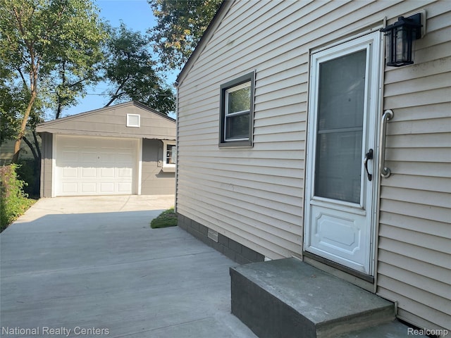 23074 Bolam Ave, Warren, MI 48089 - property entrance with a garage and concrete driveway