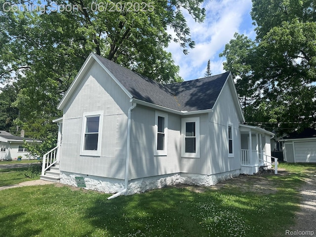 101 Morrell St, Yale, MI 48097 - view of property exterior featuring a lawn and roof with shingles
