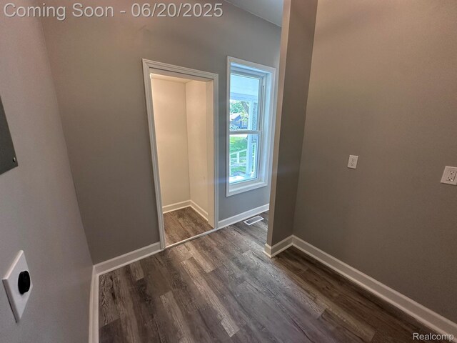 101 Morrell St, Yale, MI 48097 - hall with dark wood-style flooring and baseboards