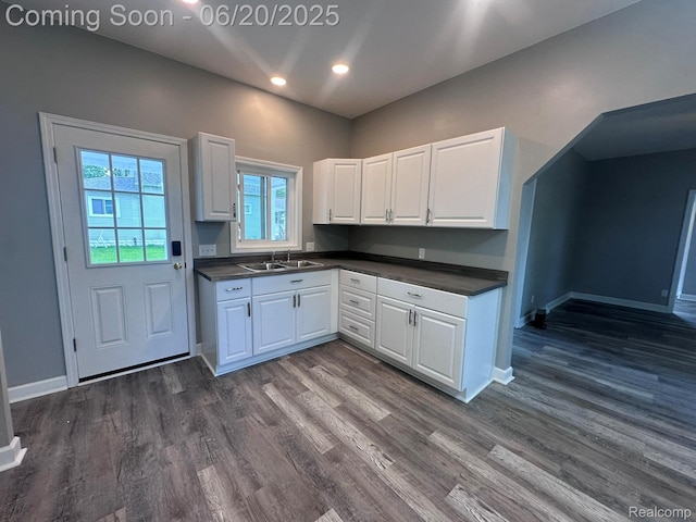 101 Morrell St, Yale, MI 48097 - kitchen featuring dark countertops, white cabinetry, dark wood finished floors, and recessed lighting