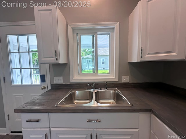 101 Morrell St, Yale, MI 48097 - kitchen featuring dark countertops and white cabinetry
