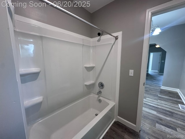 101 Morrell St, Yale, MI 48097 - full bath with wood finished floors and washtub / shower combination
