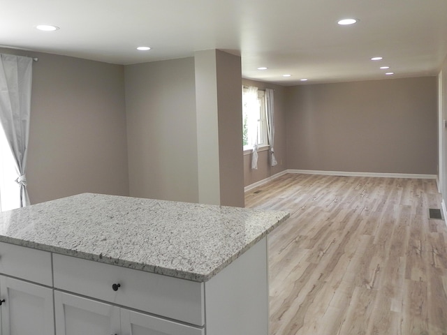 26370 S Shore Dr, Mendon, MI 49072 - kitchen with a center island, light wood-style floors, light stone counters, and recessed lighting