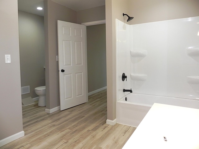 26370 S Shore Dr, Mendon, MI 49072 - bathroom with bathing tub / shower combination, wood finished floors, and recessed lighting