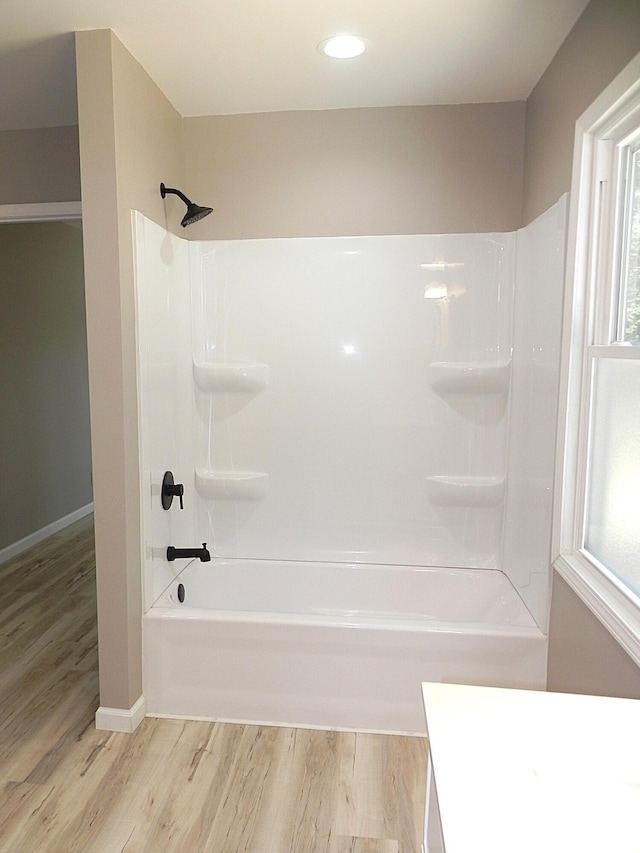 26370 S Shore Dr, Mendon, MI 49072 - full bath featuring wood finished floors, vanity, shower / tub combination, healthy amount of natural light, and recessed lighting