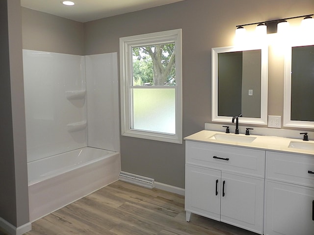 26370 S Shore Dr, Mendon, MI 49072 - full bath with double vanity, wood finished floors,  shower combination, and recessed lighting
