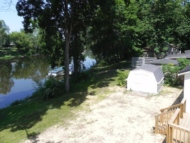 26370 S Shore Dr, Mendon, MI 49072 - view of green lawn featuring a storage unit and a water view