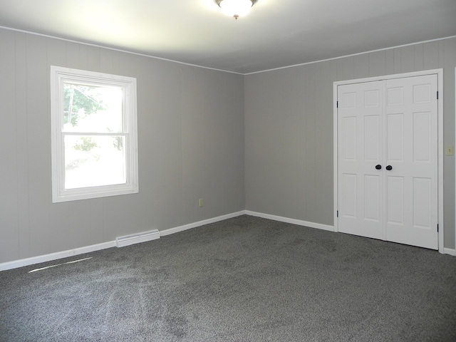 26370 S Shore Dr, Mendon, MI 49072 - unfurnished bedroom featuring dark carpet and a closet