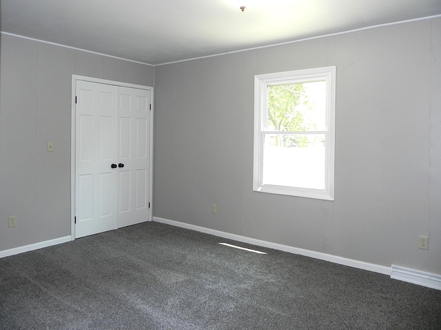 26370 S Shore Dr, Mendon, MI 49072 - unfurnished bedroom featuring dark colored carpet and a closet