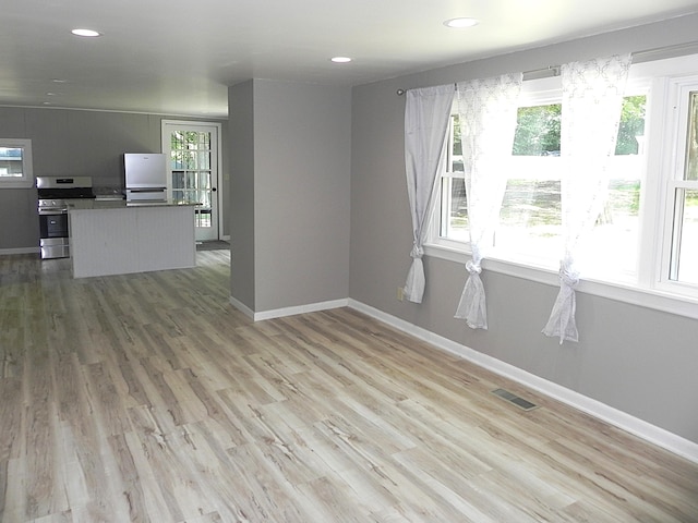 26370 S Shore Dr, Mendon, MI 49072 - unfurnished living room featuring light wood-style floors and recessed lighting