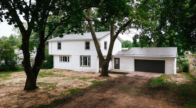 26370 S Shore Dr, Mendon, MI 49072 - view of front of property with driveway, a garage, and a metal roof