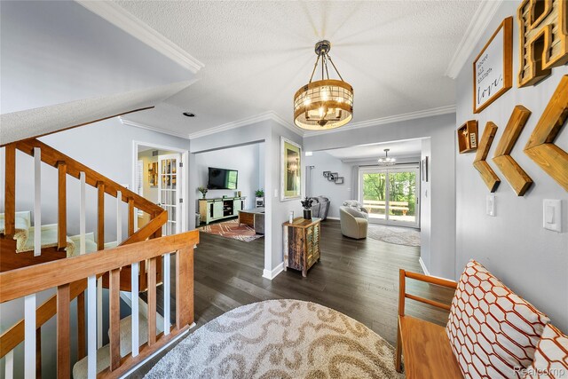 8206 Saint James Ct, Grosse Ile, MI 48138 - foyer entrance with a chandelier, ornamental molding, wood finished floors, stairway, and a textured ceiling